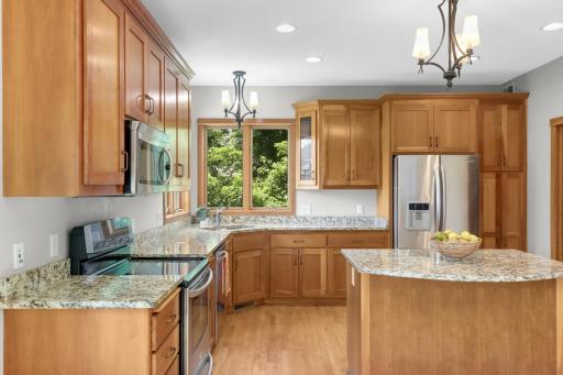 An Abundance Of Work Areas With Granite Counter Tops. No Lack Of Cabinetry In This Kitchen