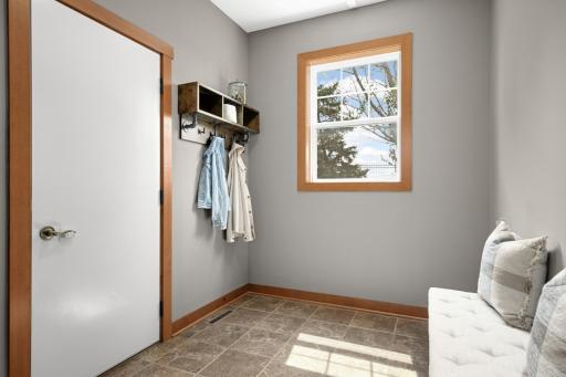 Convenient mud room leads to the heated garage