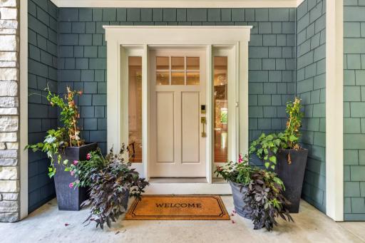 Inviting craftsman style entry door and sidelights