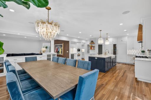 Built-in china cabinet features decorative glass doors, storage and quartz countertops