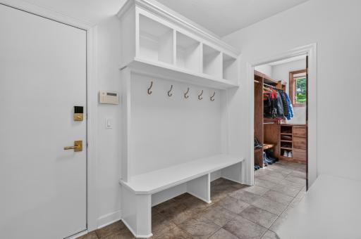 Mudroom features enameled lockers & built-in bench with storage. Garage access as well.