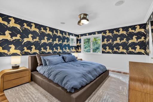 Bedroom 4 features walk-in closet with custom alder organizer and shelving. Crown Molding and chair rail