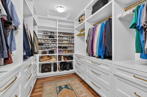 Large walk-in closet offers custom organizer