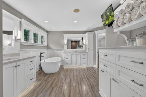 Free standing soaking tub and porcelain plank tile flooring w/ radiant in-floor heating
