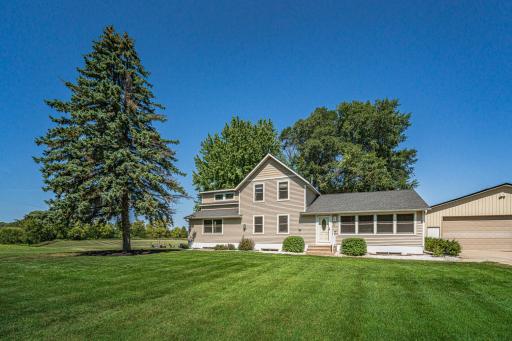 The lawn is beautifully maintained, and is lush, green, and lovingly-cared for.