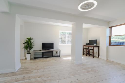 There are two large family room spaces in the lower level. This level has 9’ smooth-scraped ceilings and daylight windows on multiple sides for wonderful light and ventilation.