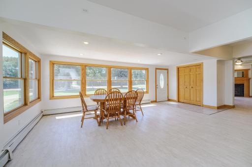 This ENORMOUS dining/gathering room with walls of windows overlooks the front yard and tree-lined drive entering the property. A coat closet lies off the front entry, and there is an organization/planning center as well.