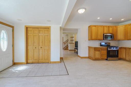 The open kitchen and dining concept leads to the family room.