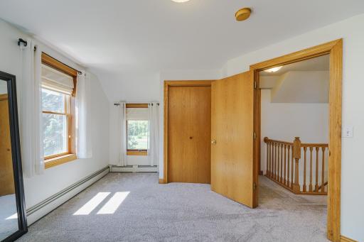 This room has unique window placement and opens to the loft.
