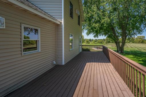 This 34' x 12' deck connects to the home via the back porch, and leads to the fenced backyard and pole building.