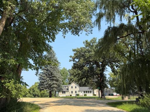 A picturesque TREE-LINED DRIVE leads to this nearly 11 acre homesite positioned within Prior Lake Schools and backing to RICE LAKE, where you can enjoy endless outdoor recreation literally 5 minutes from downtown and shopping!