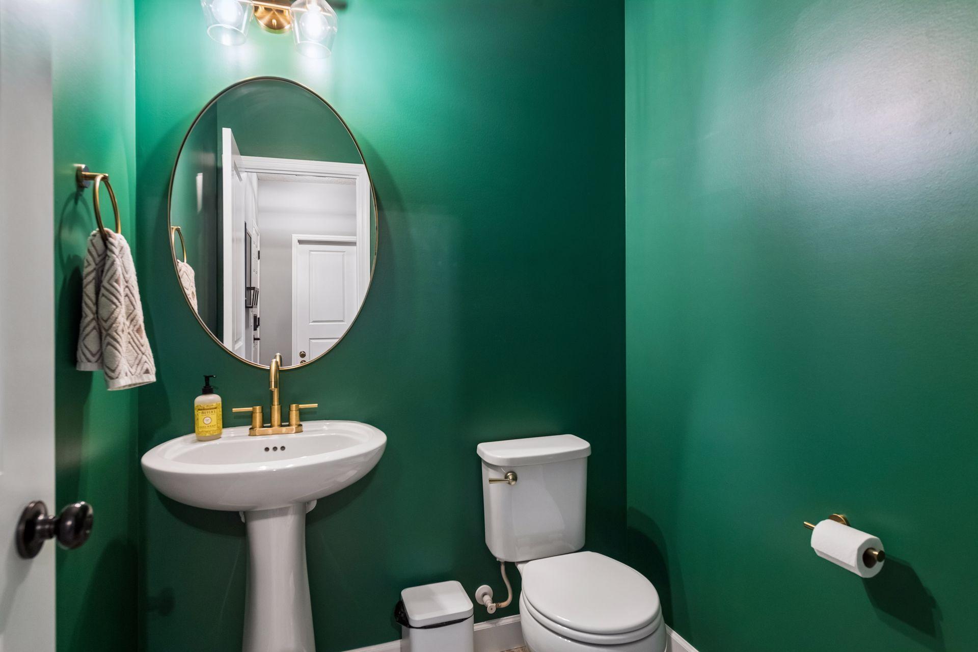 Main level 1/2 bath conveniently located off garage and kitchen.