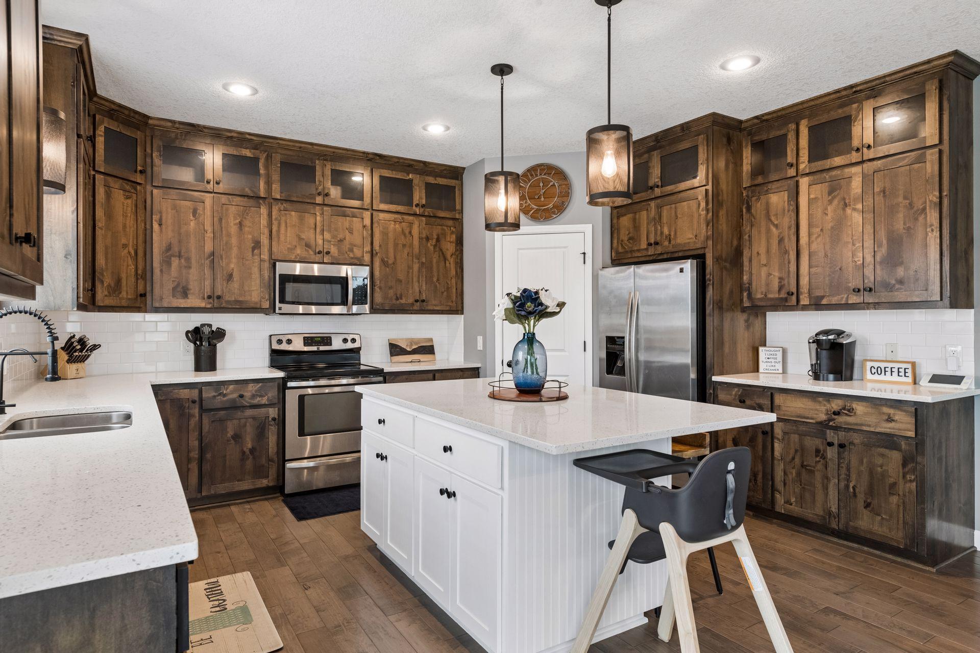 Upgrades to the kitchen include reverse osmosis system, quartz countertops, tile backsplash and stainless steel appliances.