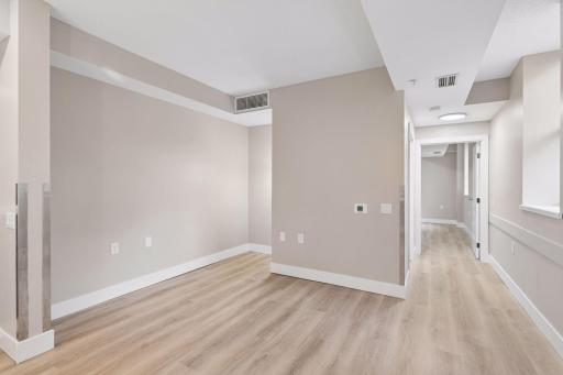 9' ceilings throughout & living room shown with access to the primary bedroom down the hall.