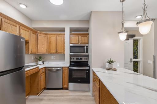 An efficient kitchen that has modernized counters & light fixtures, too!