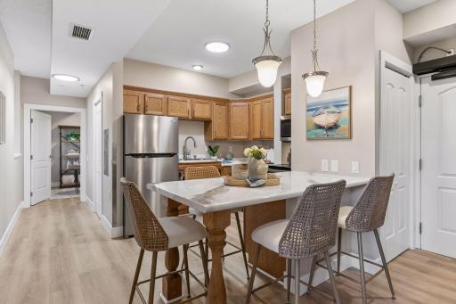 You'll love the Breakfast bar & modernized kitchen with updated counters & light fixtures!