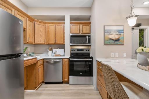 Enjoy brand new SS kitchen appliances + designed with accessibility in mind allowing for a wheelchair to roll under the kitchen counter & sink area.