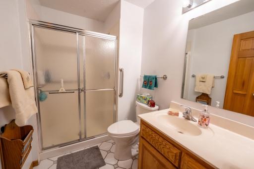 This is the three quarter bathroom that is across the hall from the fourth bedroom that's currently being used as a Home Office. Both of these are right next to the family room