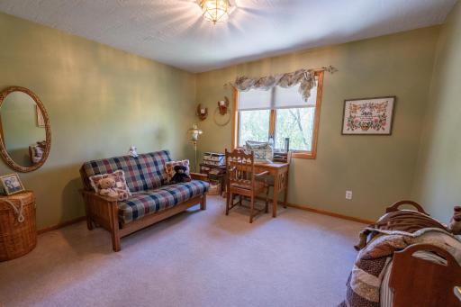 This is the second of three bedrooms on the upper level of the house. If you did not need all of them as bedrooms, any one of them would work great as an exercise room, Home Office or den