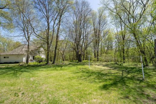 Off to the right of the garage is a huge open space where you can hang laundry. This would be a great place for a garden, fire pit or any other outdoor use you can think of