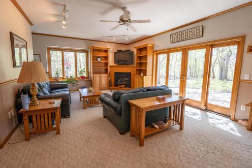 This is the family room off the living room and informal dining area. The Sliding glass doors lead to the backyard which is extremely private and a paver patio