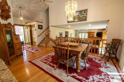 Eat-in kitchen with a very open floor plan and vaulted ceilings, beautiful hardwood floors and as you can see in the foreground is the family room.