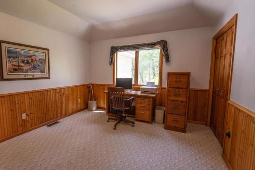 This is the fourth bedroom which is currently being used as a Home Office. This is right off the family room and across the hall from a three quarter bathroom. You could use this as a primary bedroom and have all living on one level