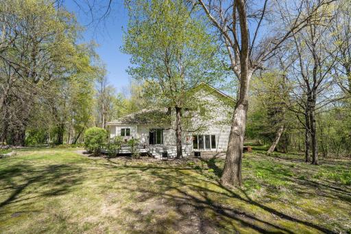 The back of the house is private. No road noise, The deck is on the left hand side and goes out from the kitchen period to the right of that is the sliding glass door from the family room that leads to the patio