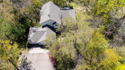 Both the roof and the siding were replaced in 2001 due to a hailstorm. As you can see lots of mature trees surround the home and the shed giving you maximum privacy