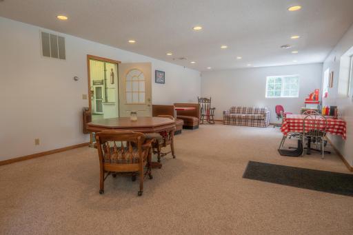 The shop is divided up into sections. The bulk of it is the huge center area where you can run a business with storage. But when you first walk in the front door you're greeted to this huge area that could make a great Home Office.