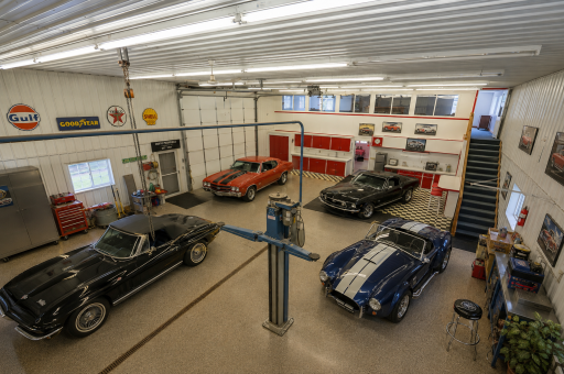 This is a classic car collector's dream. Not only do you have plenty of space to store your most prized possessions, but there's plenty of space to work on them as well. Virtually staged.