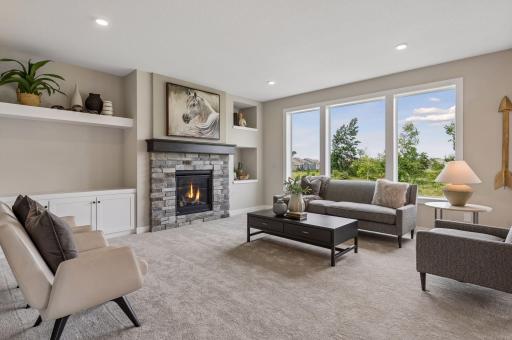 The living room on the main floor has a beautiful gas fireplace and wall built-ins.