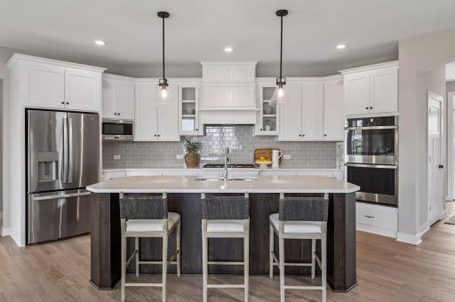 Our gourmet kitchen defines how the WOW comes standard. With a huge center island, granite countertops, gas cook top, and double ovens, plus so much more!
