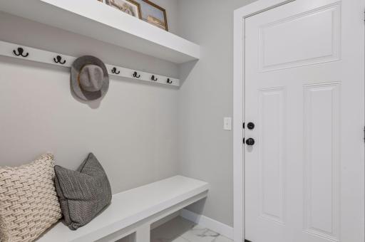 The spacious mud room helps your home stay organized.
