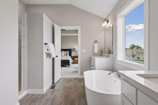 The luxurious, private bath comes with a freestanding tub.