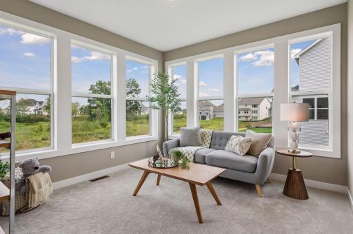 Just off the kitchen is the sun room. Use it as a reading nook or a place for your kids to play.