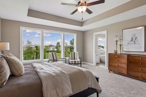 Open the grand French doors into your very own owner's suite with a private bath.