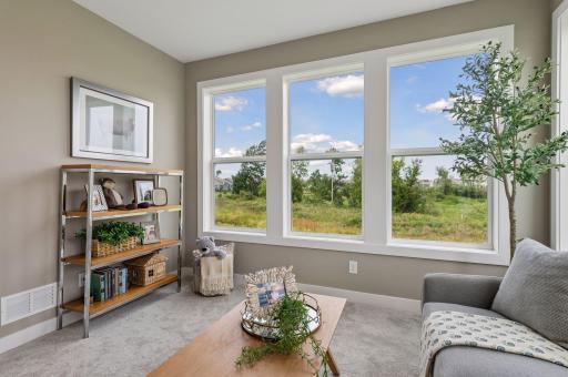 Just off the kitchen is the sun room. Use it as a reading nook or a place for your kids to play.
