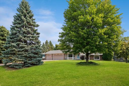 Home has a beautiful front yard.