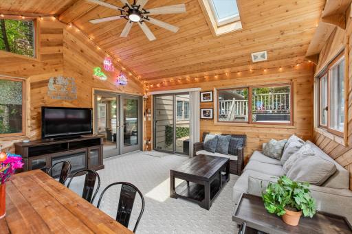 sunroom with another patio door to the hot tub area.