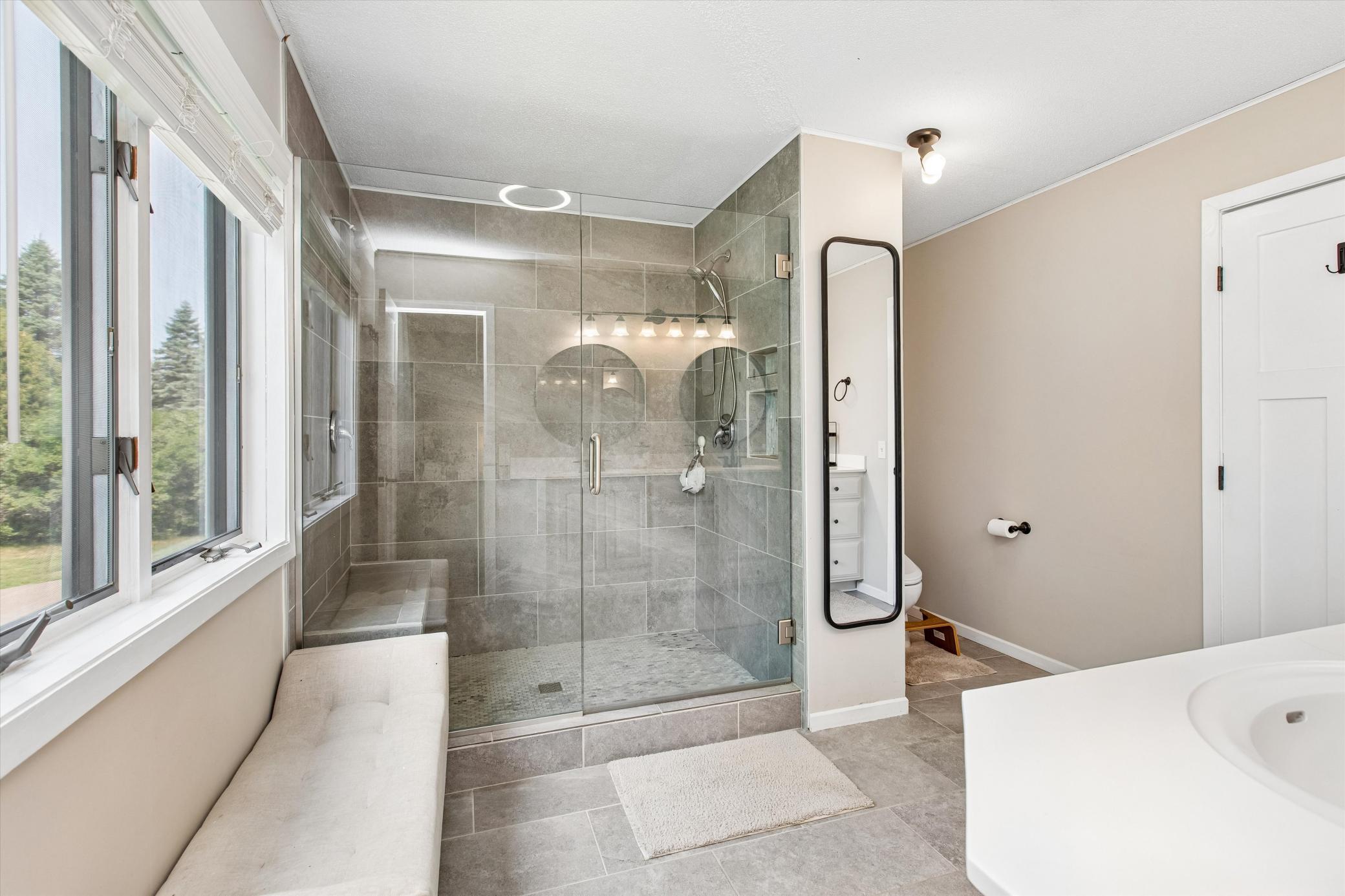 walk-in shower with builtin seat.
