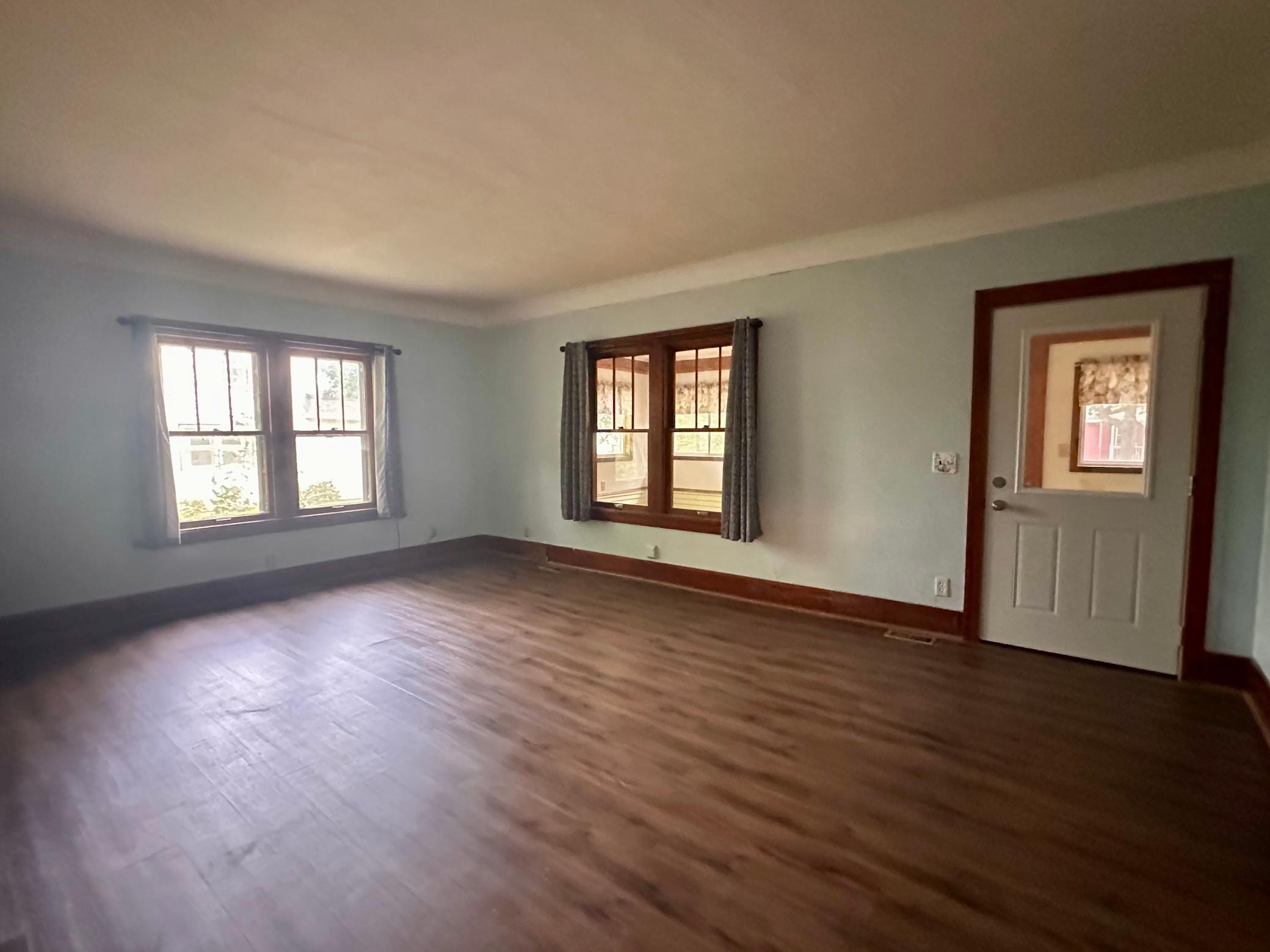 New flooring will be found throughout majority of the home - notice the new exterior doors for energy efficiency.