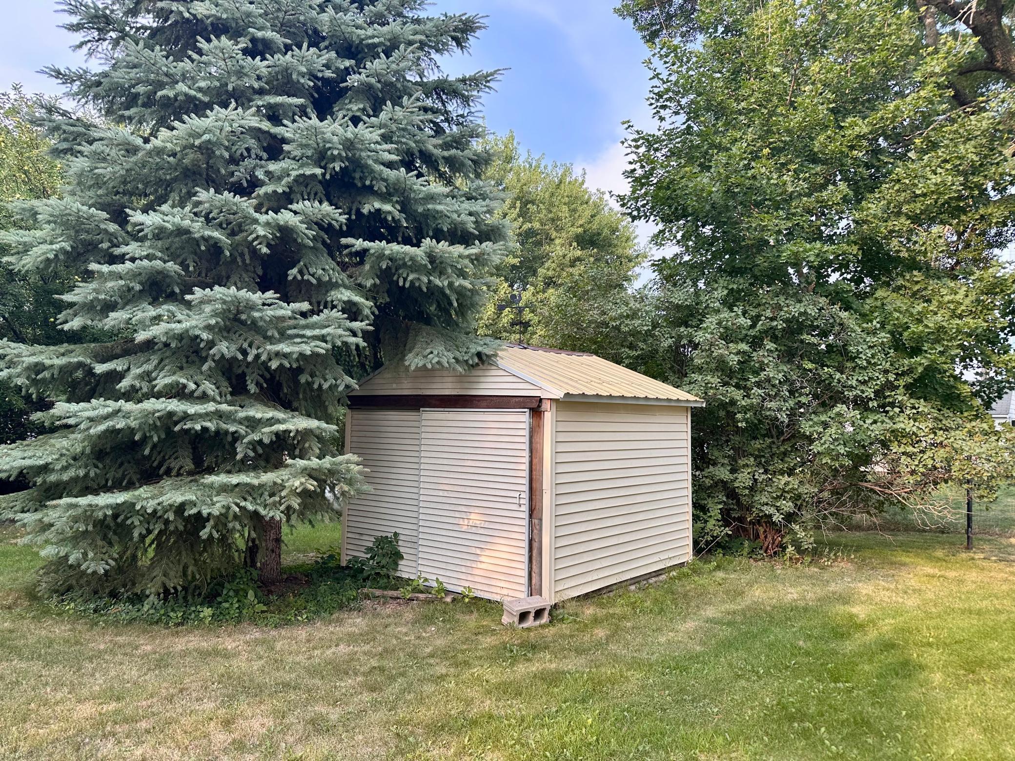 Storage Shed offers space for your lawn mower, gardening tools, or yard toys.