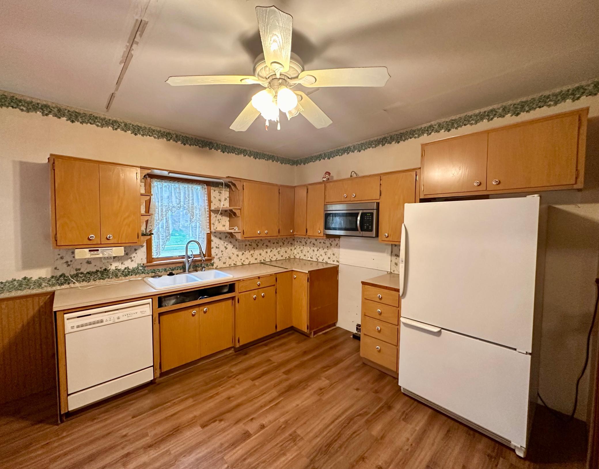 Access to the side deck, window view by the kitchen sink, and a dishwasher!
