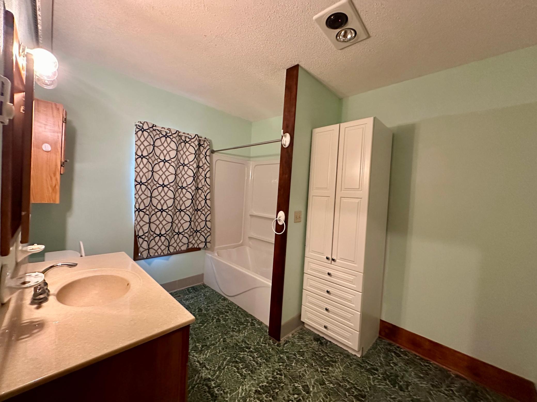 Main Floor Full Bathroom offers space waiting to be filled
