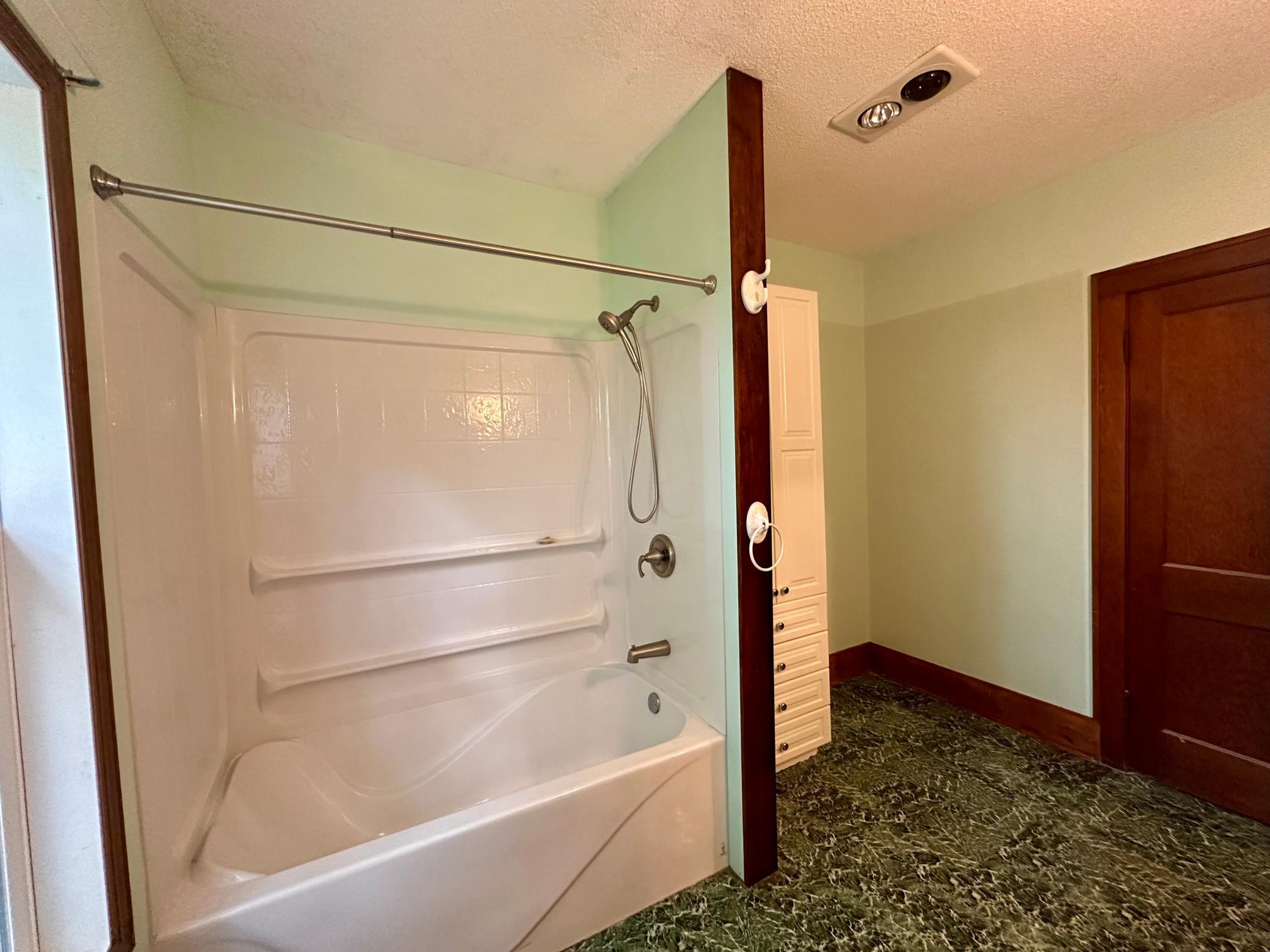 Additional space in the bathroom, and a linen closet!