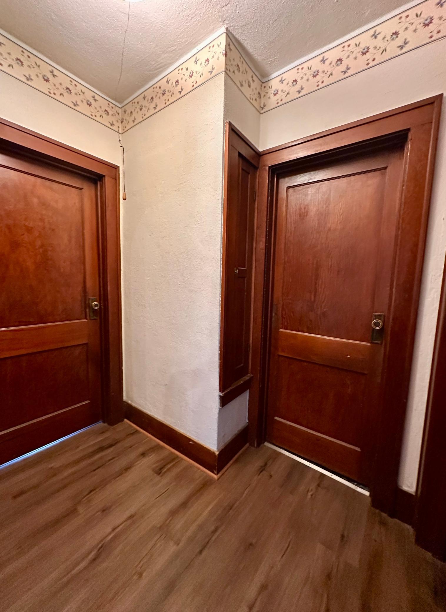 Main Floor Hallway leads to the 2 baths and 2nd bedroom - don't miss the multiple built-ins for additional storage!