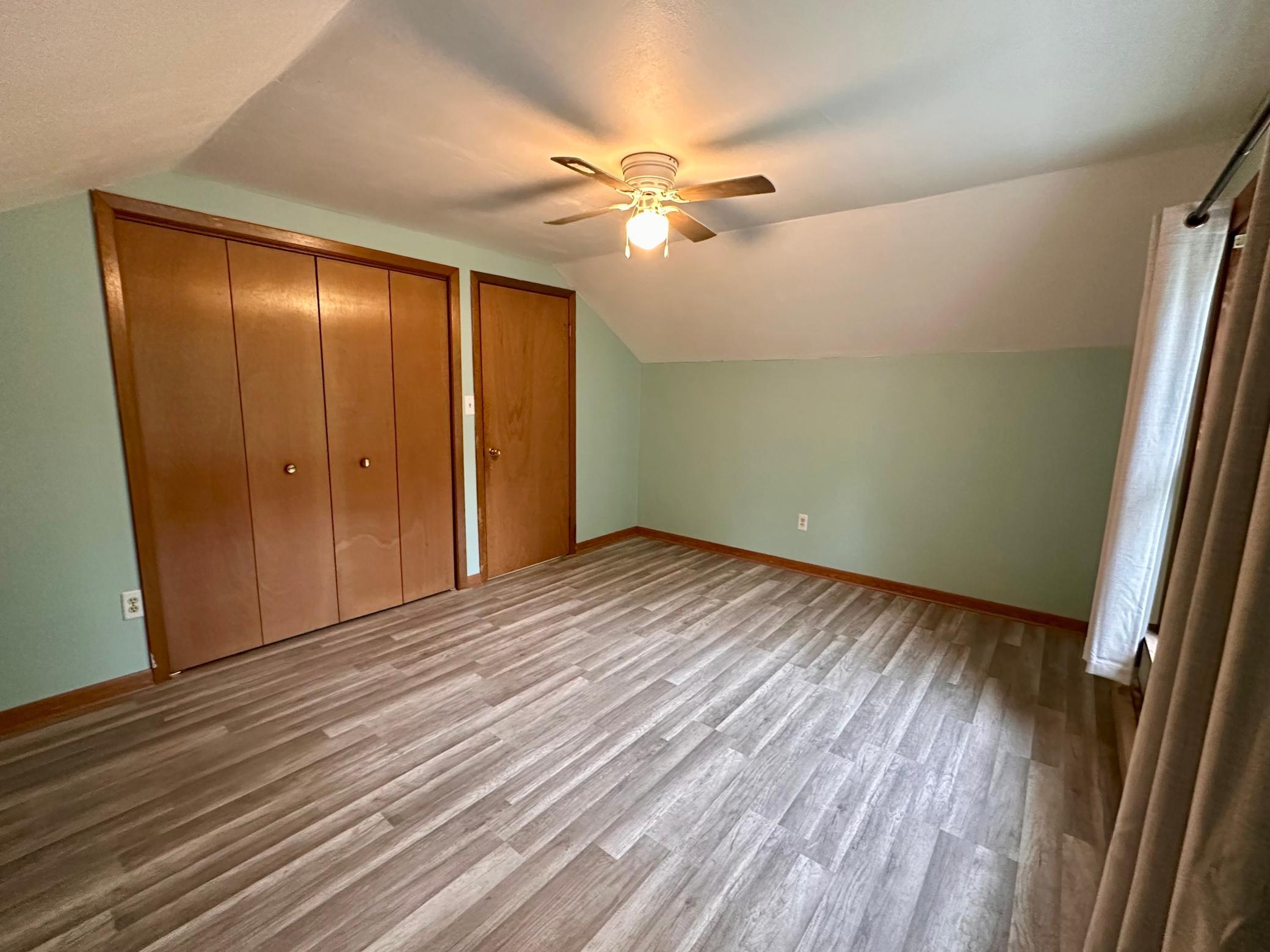 Upper Level 3rd Bedroom features large closet and extra attic storage space also.
