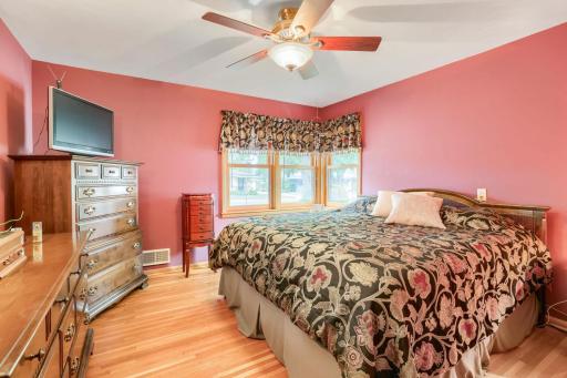 Rich hardwood flooring in the main bedroom.
