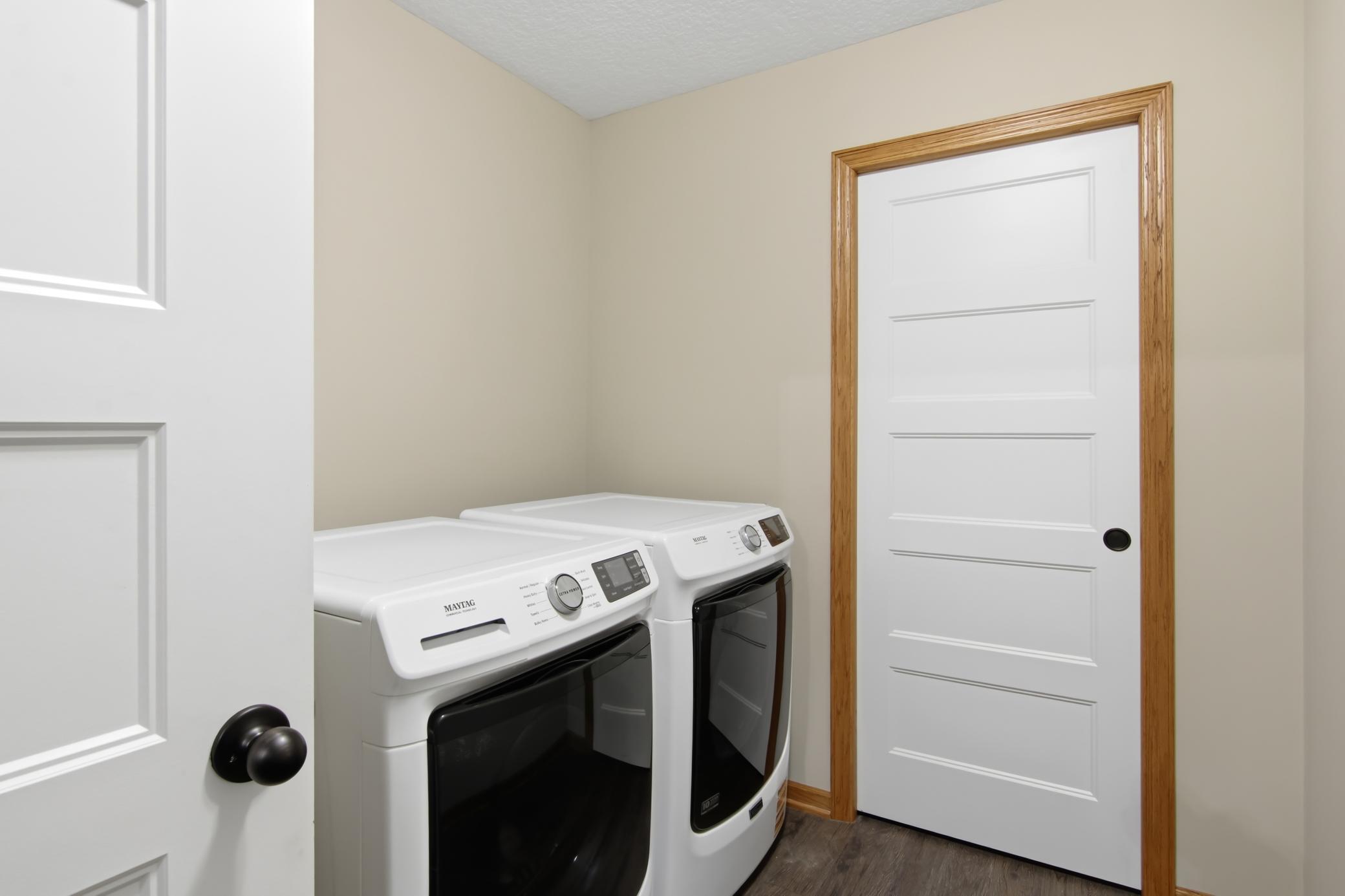 Laundry Room with coat closet